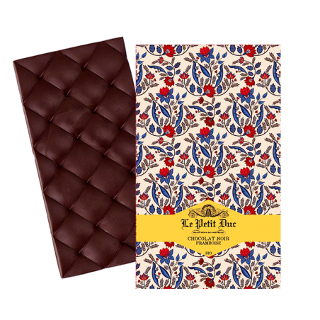 Tablette Chocolat Noir et Framboise : mariage gourmand entre la framboise acidulée et la rondeur du chocolat noir.